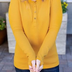 Henley top with thumb hole in mustard